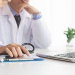 Doctor on analysis over laptop